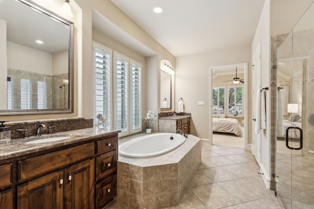 5924 Heron Bay Ln, Mckinney, TX 75070 - ensuite bathroom with a stall shower, two vanities, a bath, tile patterned floors, and ceiling fan