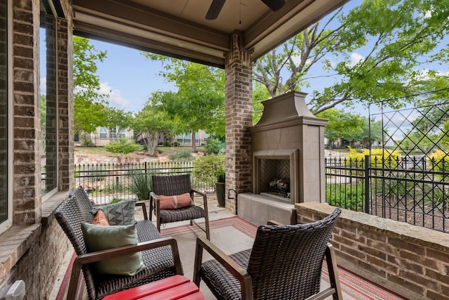 5924 Heron Bay Ln, Mckinney, TX 75070 - view of patio / terrace with ceiling fan, a tiled fireplace, and fence