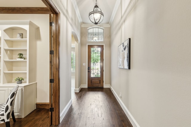 5924 Heron Bay Ln, Mckinney, TX 75070 - entrance foyer with ornamental molding, dark wood-style flooring, and a chandelier