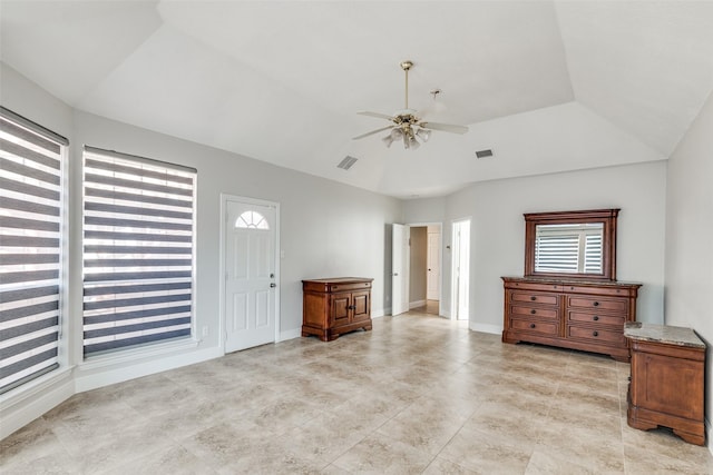 interior space featuring light tile patterned floors, a ceiling fan, lofted ceiling, and visible vents