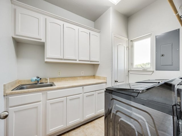 clothes washing area with electric panel, washing machine and dryer, cabinet space, a sink, and light tile patterned floors