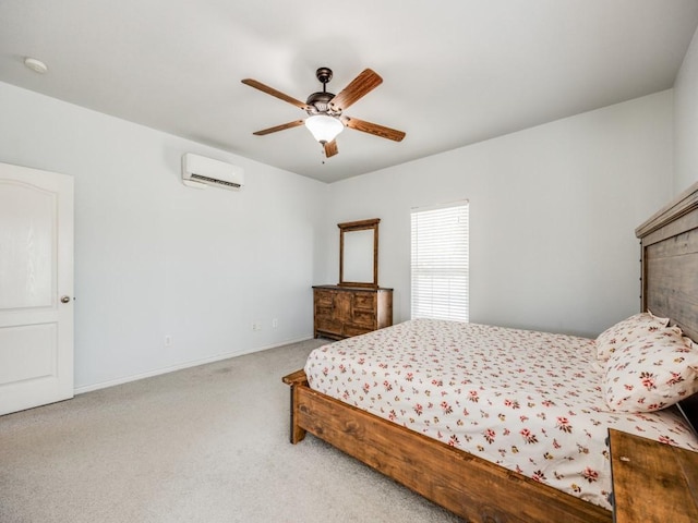 carpeted bedroom featuring baseboards, ceiling fan, and a wall mounted AC