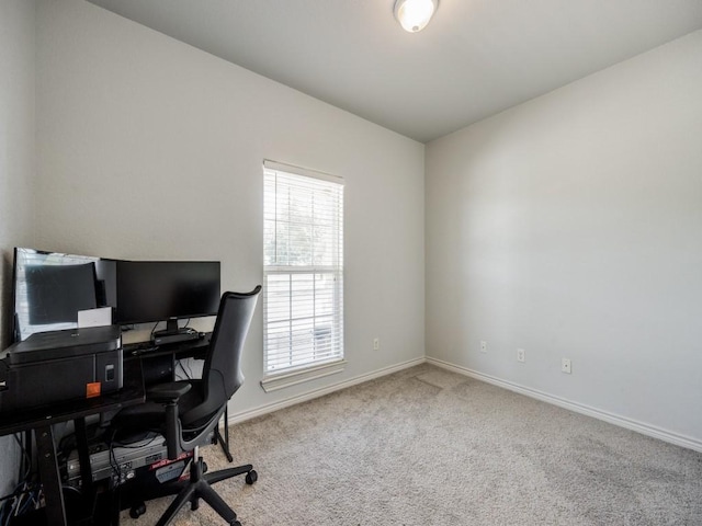 carpeted office with baseboards