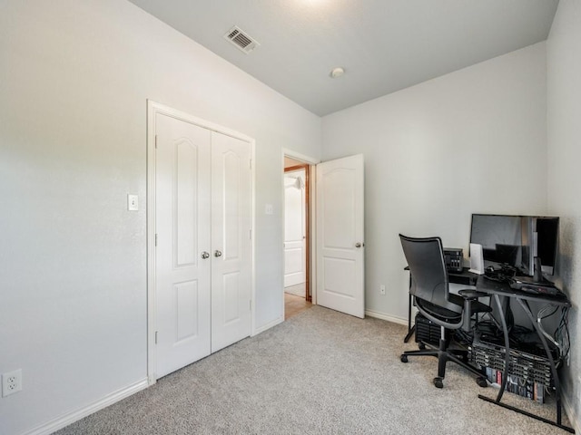 carpeted home office featuring baseboards and visible vents