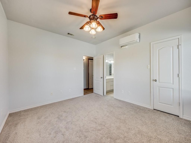 unfurnished bedroom with baseboards, visible vents, a wall mounted air conditioner, and light colored carpet