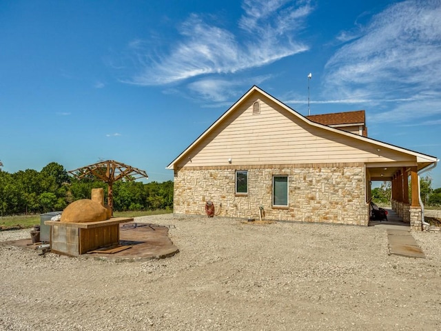 view of home's exterior with stone siding