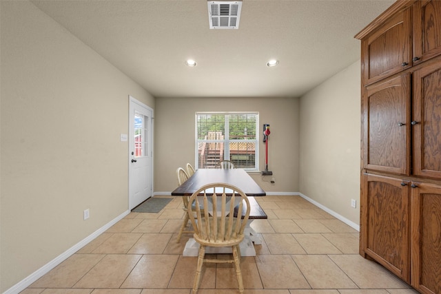 dining room with recessed lighting, baseboards, visible vents, and light tile patterned flooring