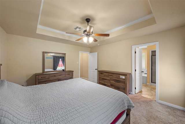 bedroom with light carpet, a raised ceiling, baseboards, visible vents, and ornamental molding
