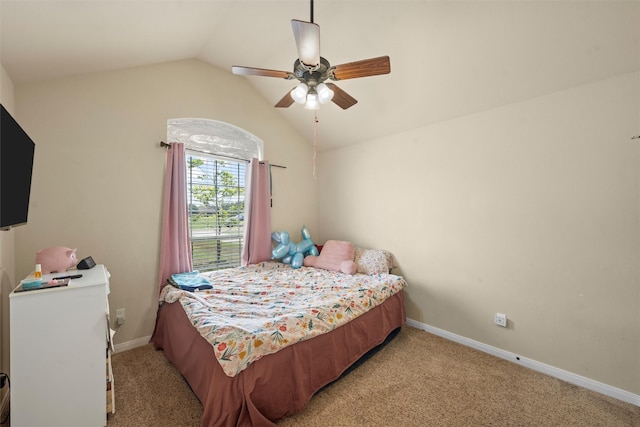 bedroom featuring baseboards, ceiling fan, light carpet, and lofted ceiling
