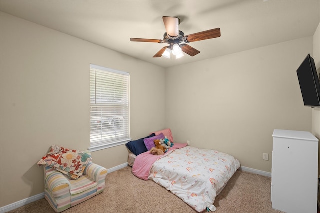 carpeted bedroom with baseboards and ceiling fan