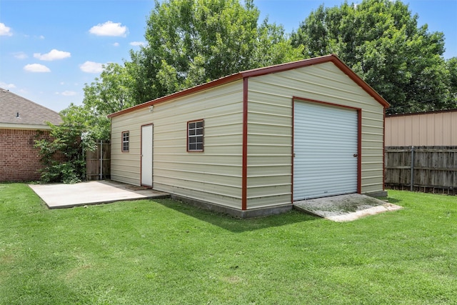 view of outbuilding featuring a fenced backyard and an outbuilding