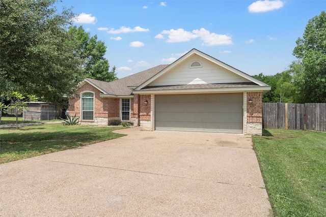 ranch-style house with fence, a shingled roof, brick siding, a front yard, and driveway