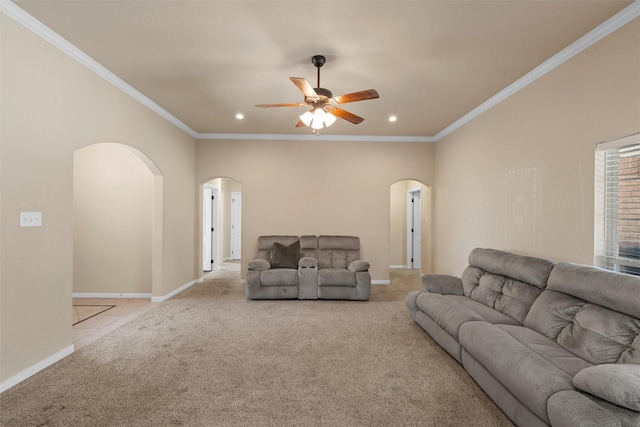 carpeted living room featuring arched walkways, ornamental molding, a ceiling fan, and recessed lighting