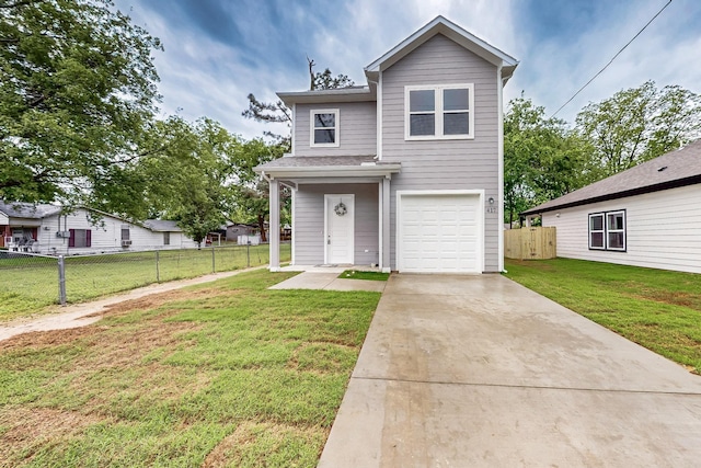 traditional-style home with fence, an attached garage, driveway, and a front yard