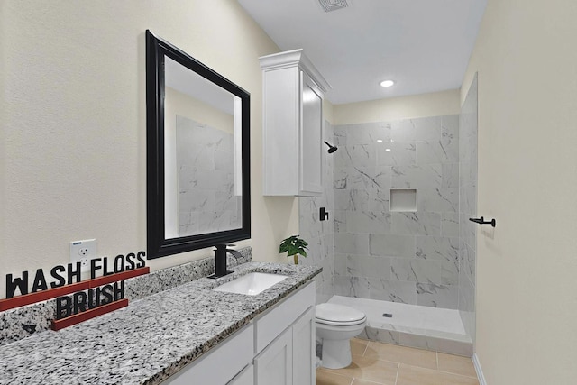 full bath featuring toilet, a shower stall, tile patterned flooring, and vanity