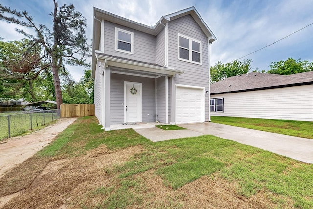 traditional-style home with an attached garage, a front lawn, fence, and driveway