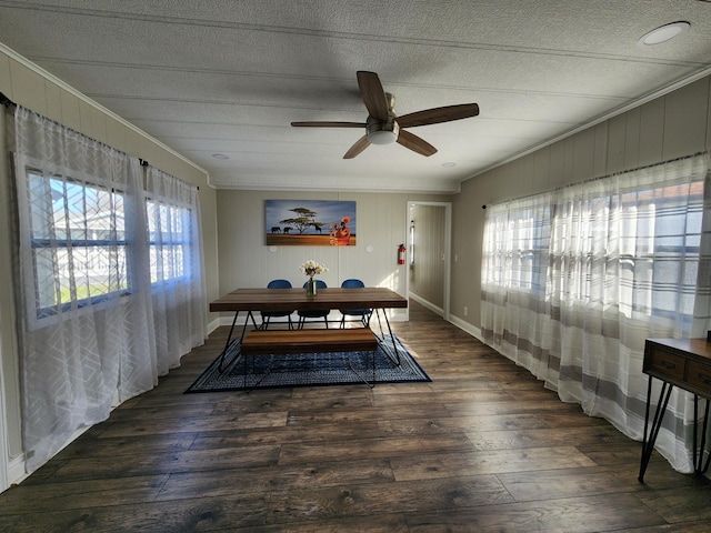 dining space featuring crown molding, a ceiling fan, baseboards, and hardwood / wood-style floors