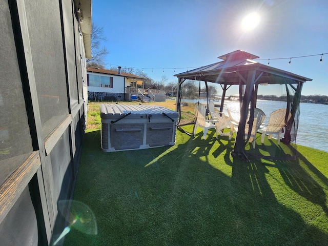 view of yard with a water view and a gazebo