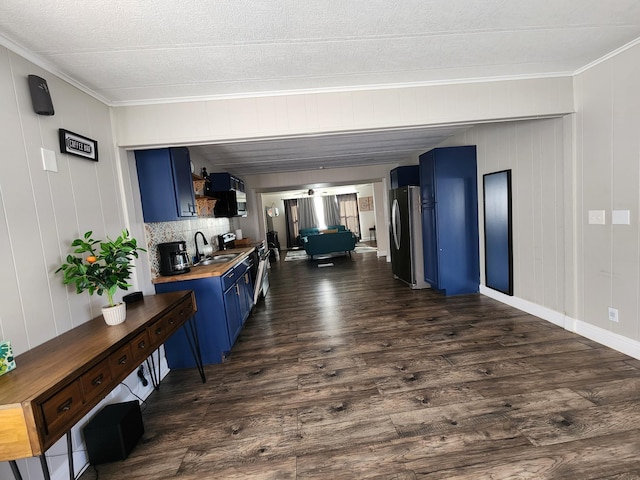 interior space with crown molding, a sink, and dark wood-style floors