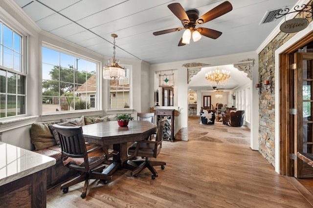 8121 Cahoba Dr, Fort Worth, TX 76135 - dining room with a chandelier, ornamental molding, wood finished floors, a ceiling fan, and breakfast area