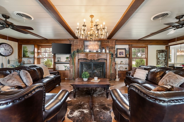 8121 Cahoba Dr, Fort Worth, TX 76135 - living area with a ceiling fan, beamed ceiling, a chandelier, a fireplace, and wooden walls