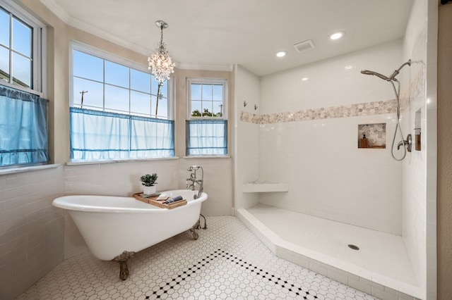 8121 Cahoba Dr, Fort Worth, TX 76135 - full bath featuring tiled shower, a soaking tub, a chandelier, ornamental molding, and tile walls