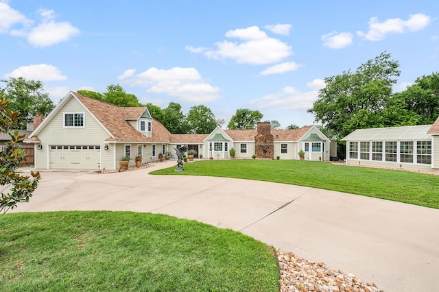8121 Cahoba Dr, Fort Worth, TX 76135 - view of front of home featuring concrete driveway, a front yard, and a garage