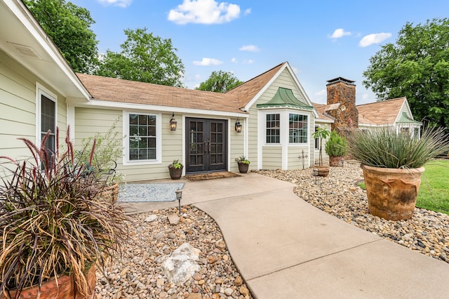 8121 Cahoba Dr, Fort Worth, TX 76135 - view of front of house with french doors and roof with shingles
