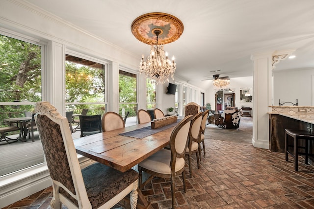8121 Cahoba Dr, Fort Worth, TX 76135 - dining room with a chandelier, brick flooring, and crown molding