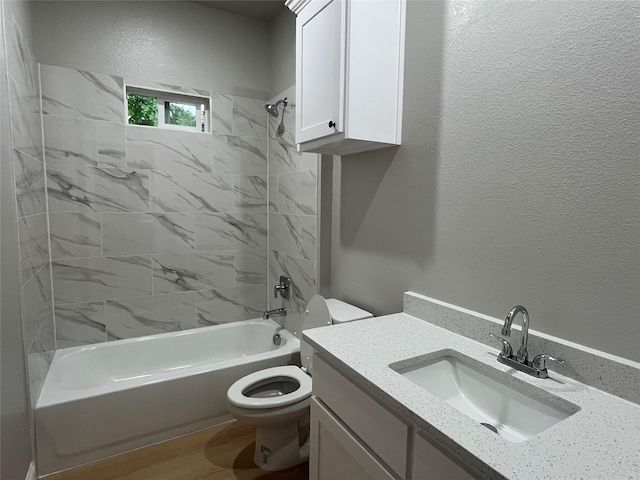 full bathroom with vanity,  shower combination, and toilet