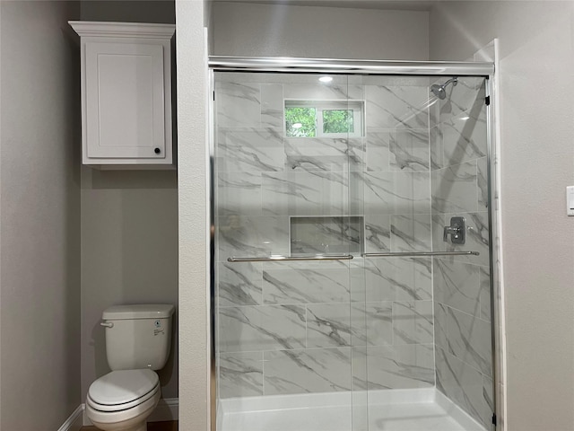 full bath with a stall shower and toilet