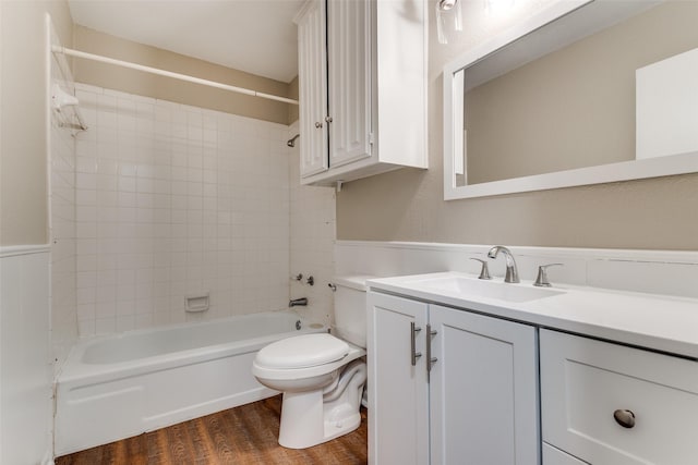 full bathroom featuring vanity, shower / bathtub combination, toilet, and wood finished floors