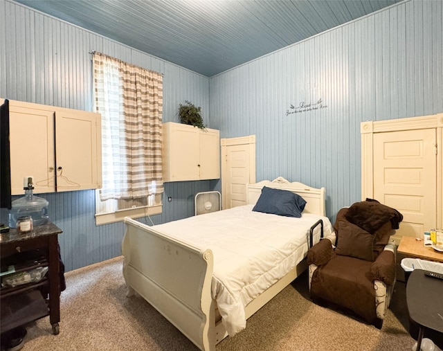 bedroom featuring wallpapered walls and light carpet