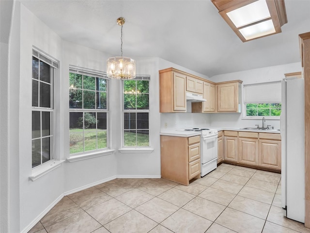 kitchen featuring light brown cabinetry, white appliances, light countertops, under cabinet range hood, and a chandelier