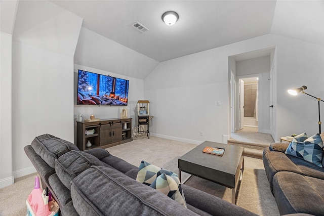 living area featuring baseboards, visible vents, light carpet, and lofted ceiling