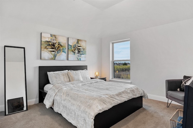 bedroom with carpet floors and baseboards