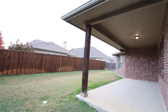view of yard with a fenced backyard and a patio