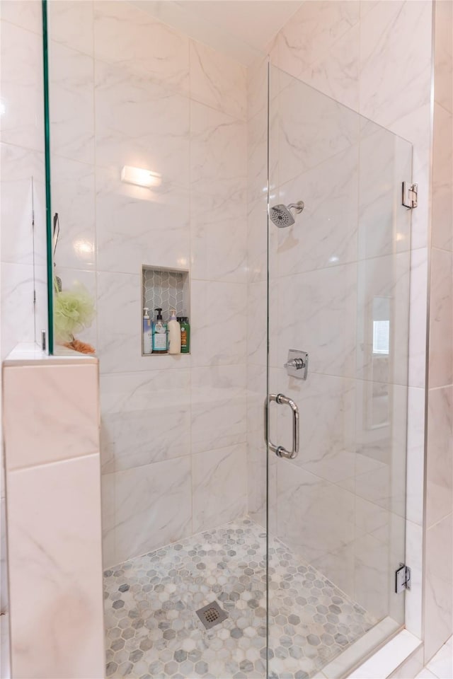 full bath with a shower stall