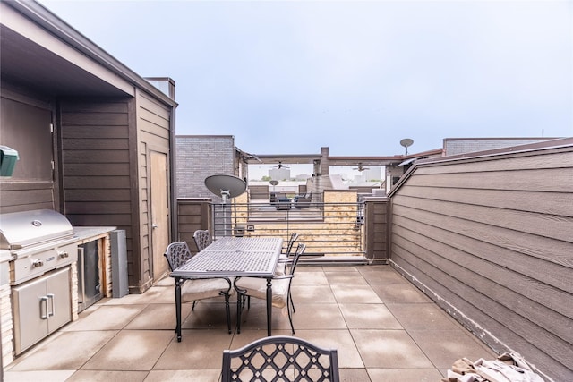 view of patio / terrace featuring outdoor dining area, a balcony, and a grill