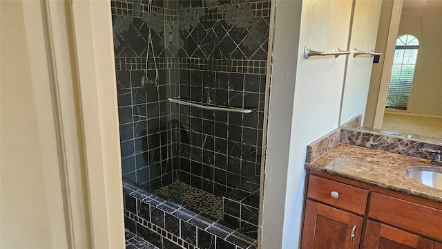 bathroom featuring vanity and a tile shower