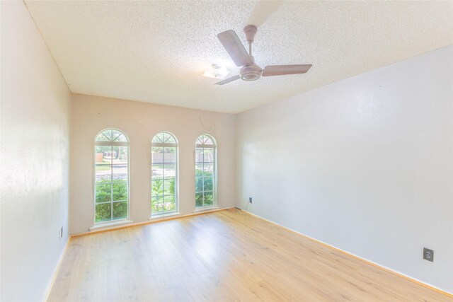 2418 Ingleside Dr, Grand Prairie, TX 75050 - full bath featuring a textured wall, toilet, a shower stall, and vanity