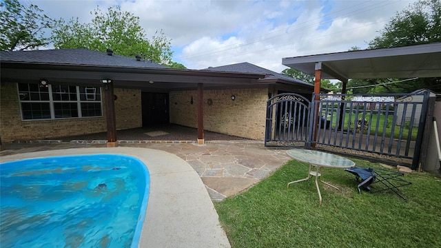 view of swimming pool with a patio area and fence