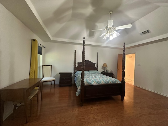 824 Imogene Ct, Azle, TX 76020 - bedroom with visible vents, wood finished floors, baseboards, ceiling fan, and a raised ceiling