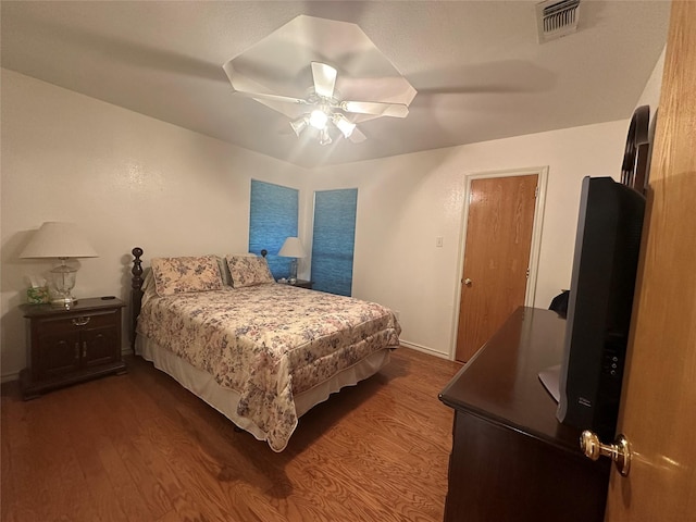 824 Imogene Ct, Azle, TX 76020 - bedroom with baseboards, ceiling fan, dark wood finished floors, and visible vents