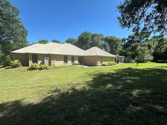824 Imogene Ct, Azle, TX 76020 - back of house featuring a yard and metal roof