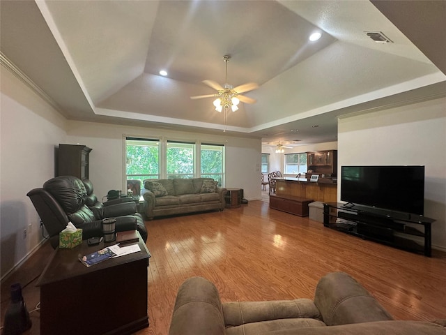 824 Imogene Ct, Azle, TX 76020 - living room featuring visible vents, wood finished floors, recessed lighting, a tray ceiling, and a ceiling fan