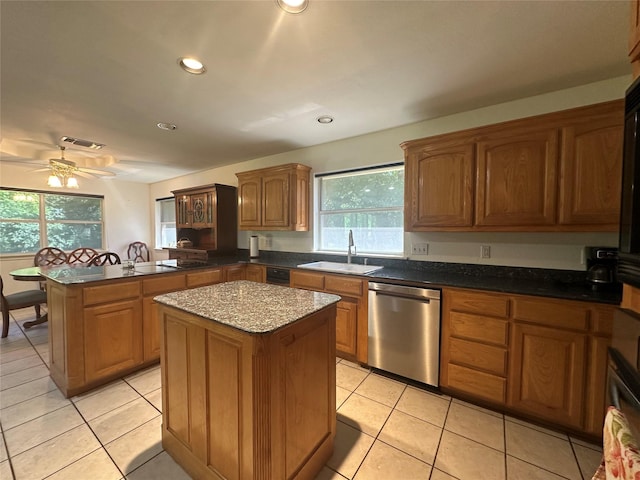 824 Imogene Ct, Azle, TX 76020 - kitchen featuring a sink, dishwasher, a peninsula, a kitchen island, and visible vents