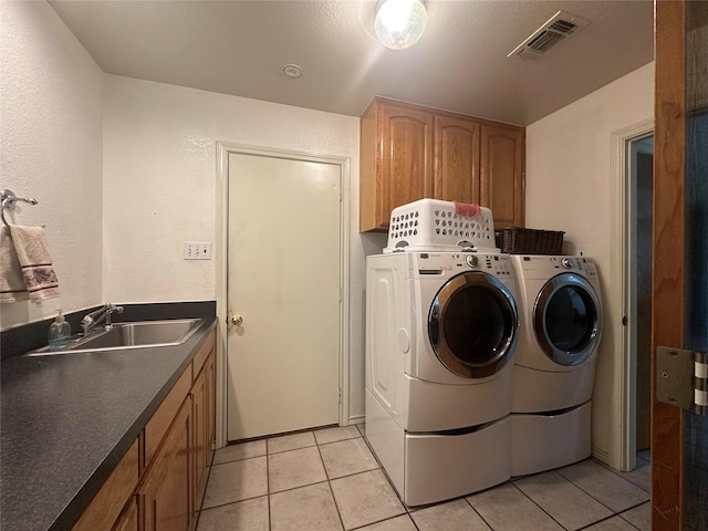 824 Imogene Ct, Azle, TX 76020 - clothes washing area with cabinet space, a sink, separate washer and dryer, light tile patterned floors, and visible vents