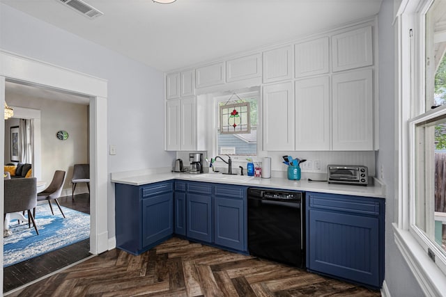 kitchen featuring blue cabinetry, visible vents, a sink, light countertops, and black dishwasher