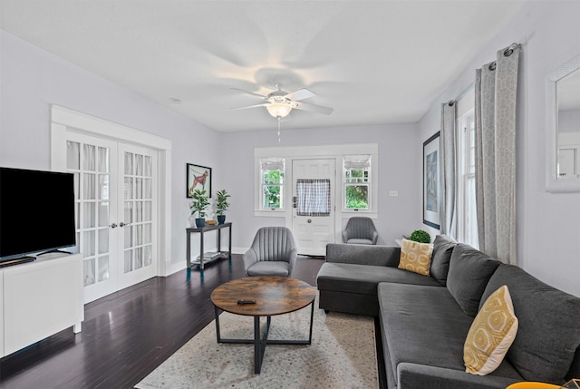 living area with baseboards, a ceiling fan, french doors, and wood finished floors